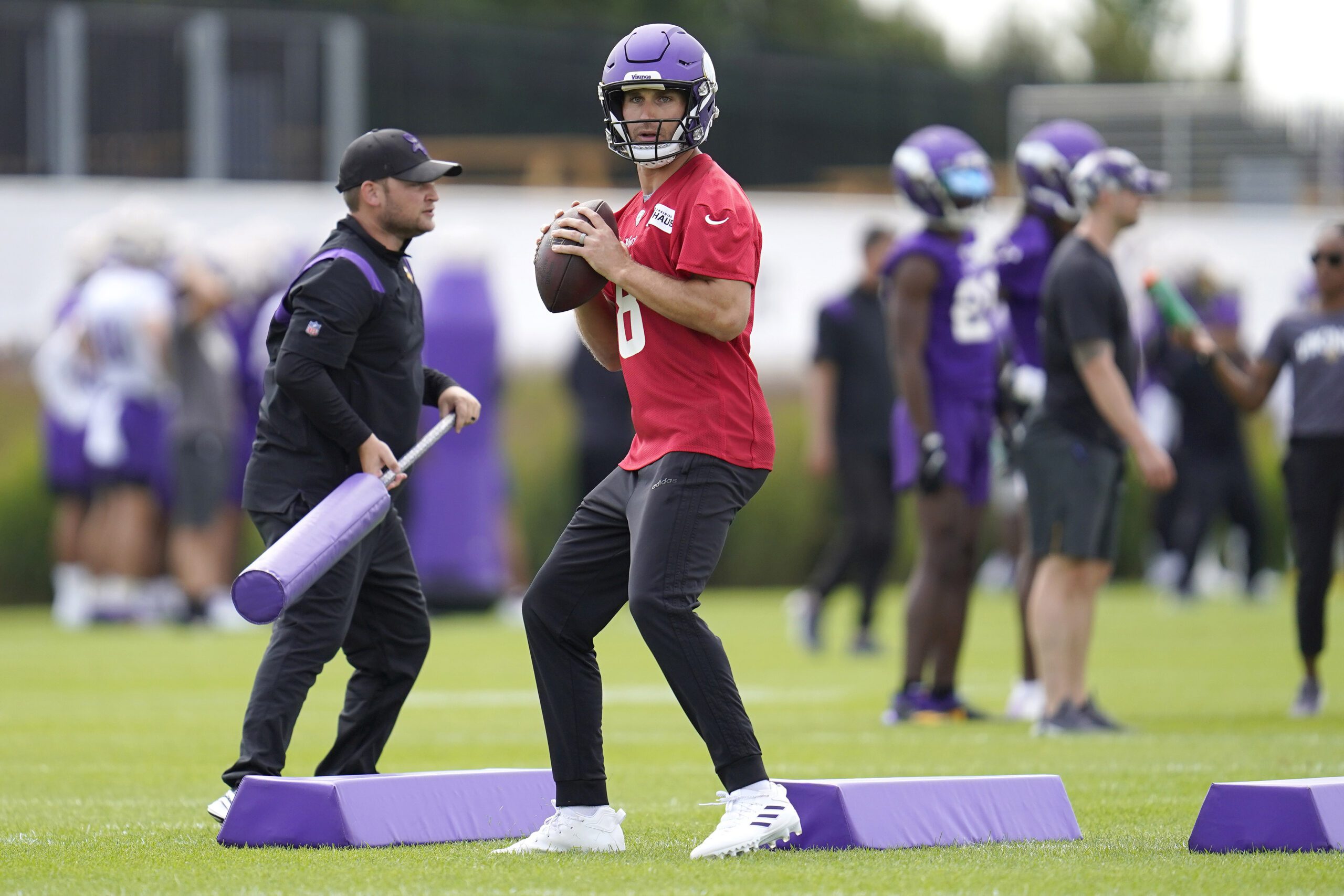 Minnesota Vikings quarterback Kirk Cousins takes part in drills.