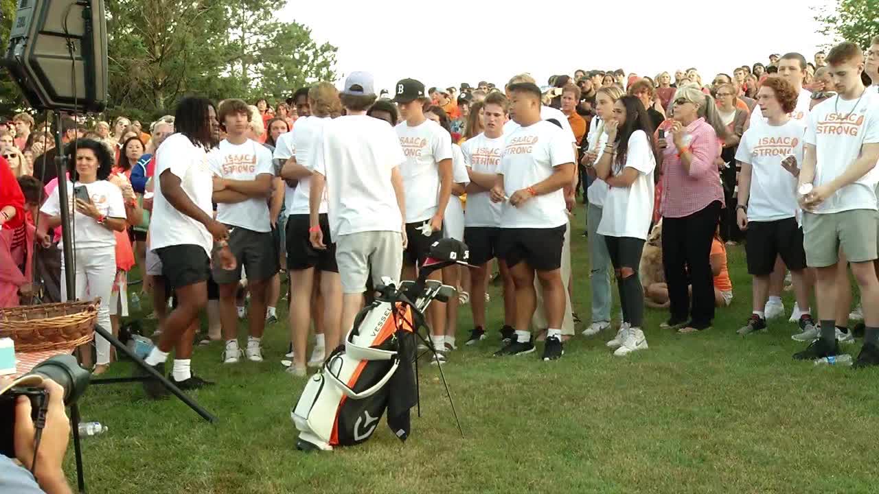 Teens gather at a golf course vigil for a 17-year-old killed