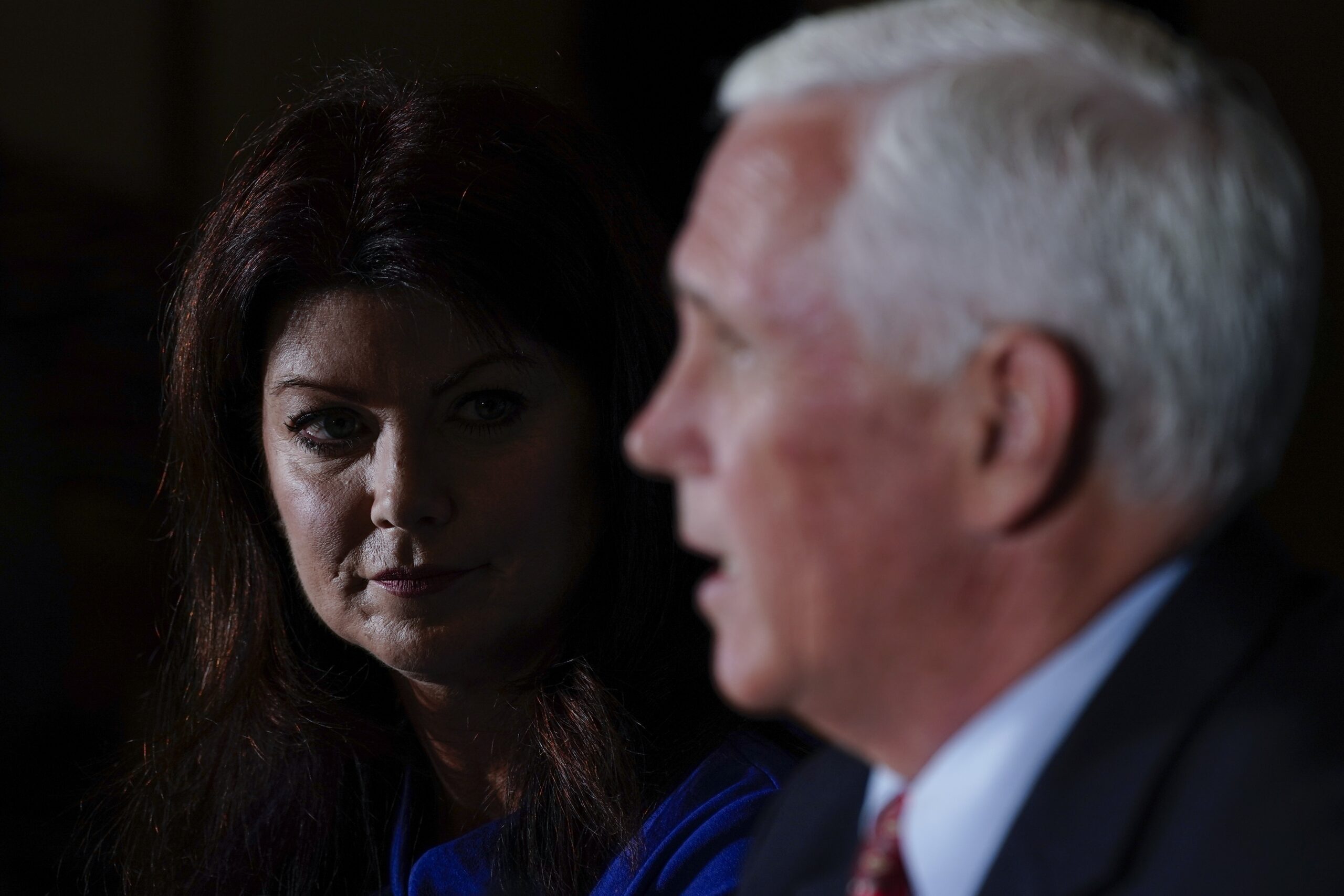 Wisconsin Republican governor candidate Rebecca Kleefisch looks at former Vice President Mike Pence