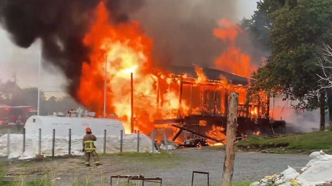 Fire at Flames engulf a structure at Northernaire Houseboats