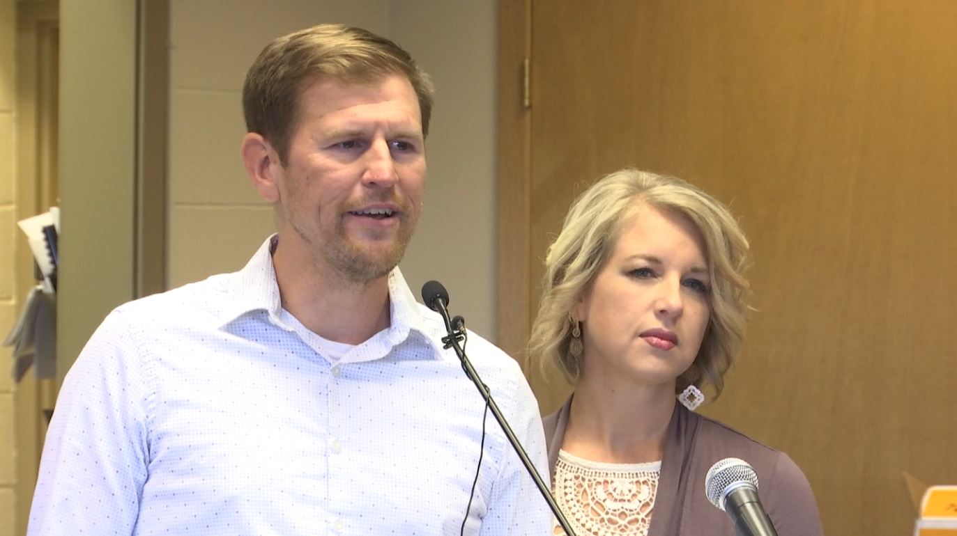 Two Harbors Mayor Chris Swanson speaks at a podium.