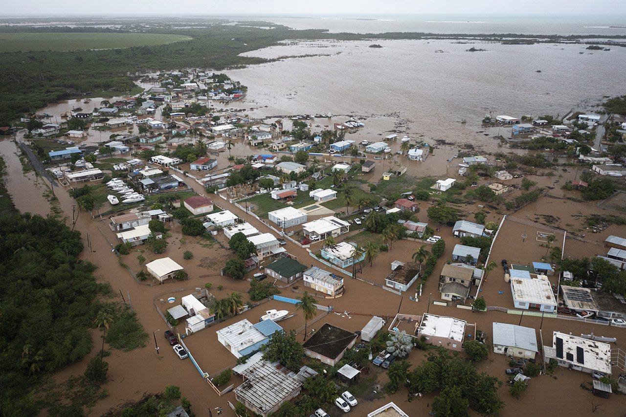 Homes are flooded on Salinas Beach after the passing of Hurricane Fiona in Salinas, Puerto Rico, Monday, Sept. 19, 2022. (AP Photo/Alejandro Granadillo) Aerial view Hurricane Fiona floods Salinas, Puerto Rico
