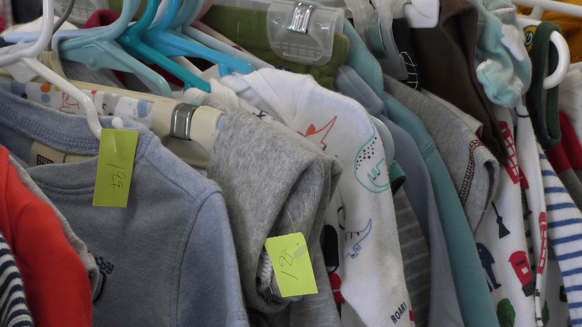 Baby clothes on a rack at the Superior Salvation Army location