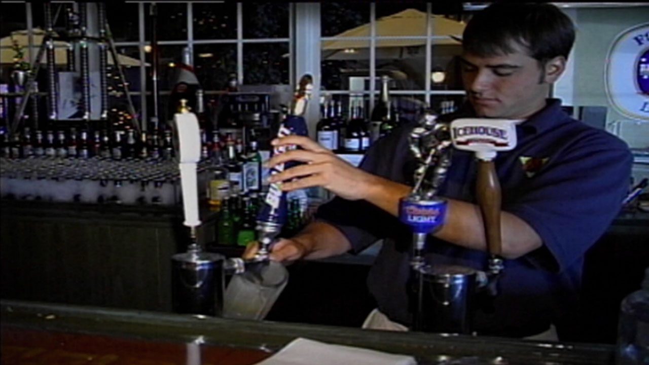 picture of bartender filling a pitcher