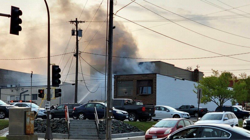 Smoke rises from a building on fire in Duluth's Hillside