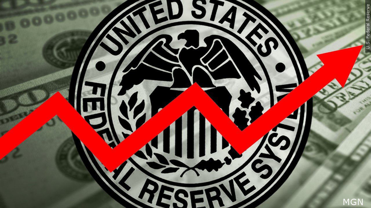 Federal Reserve logo with red arrow going up