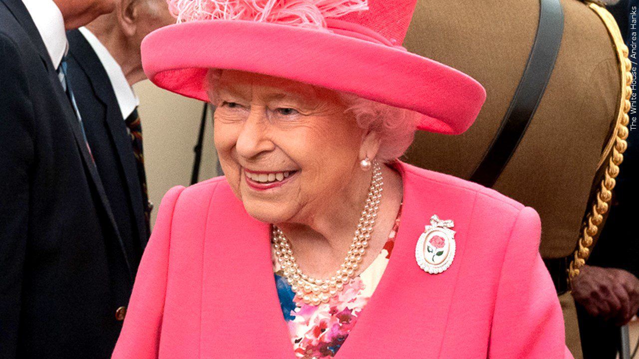 Queen Elizabeth II wearing a pink outfit