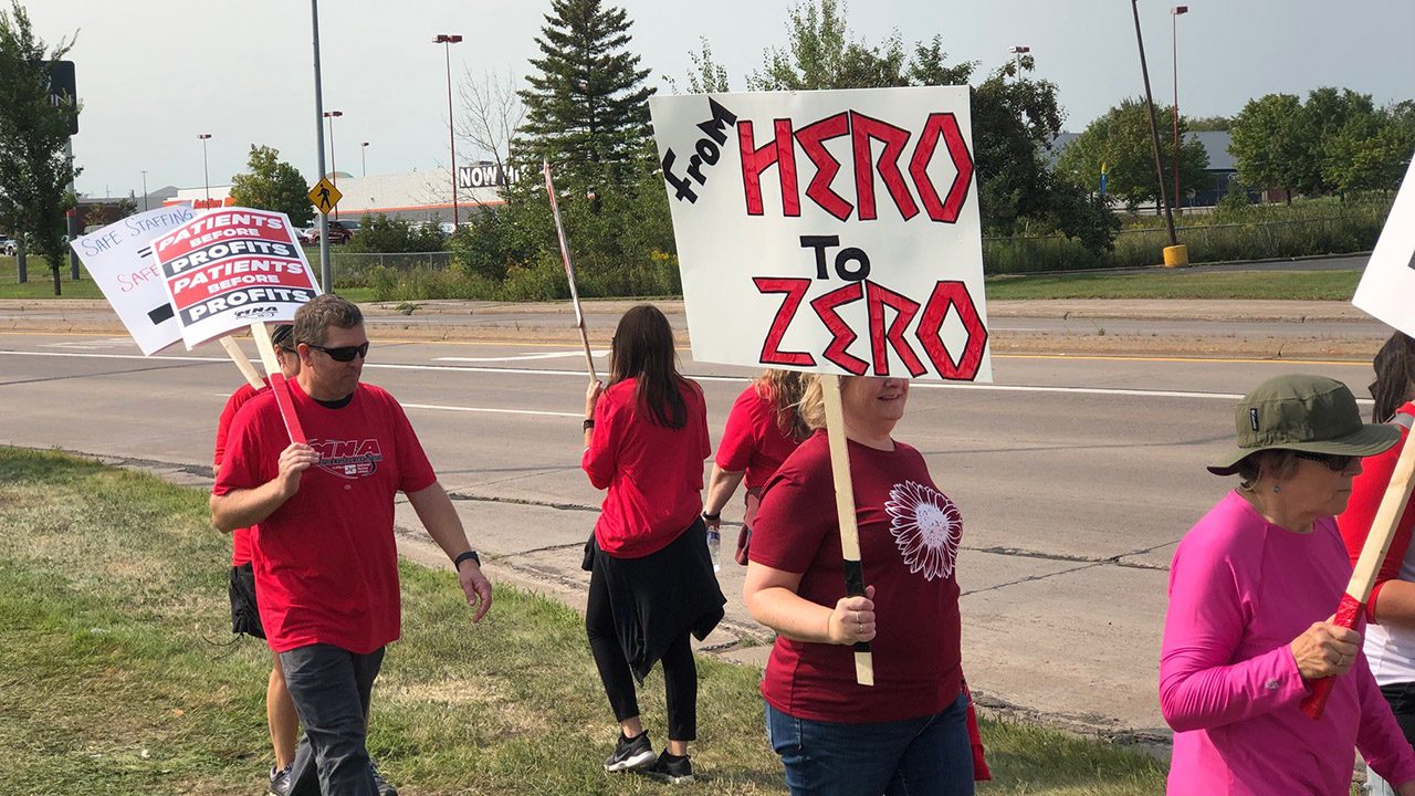 Nurses with signs picket in Minnesota