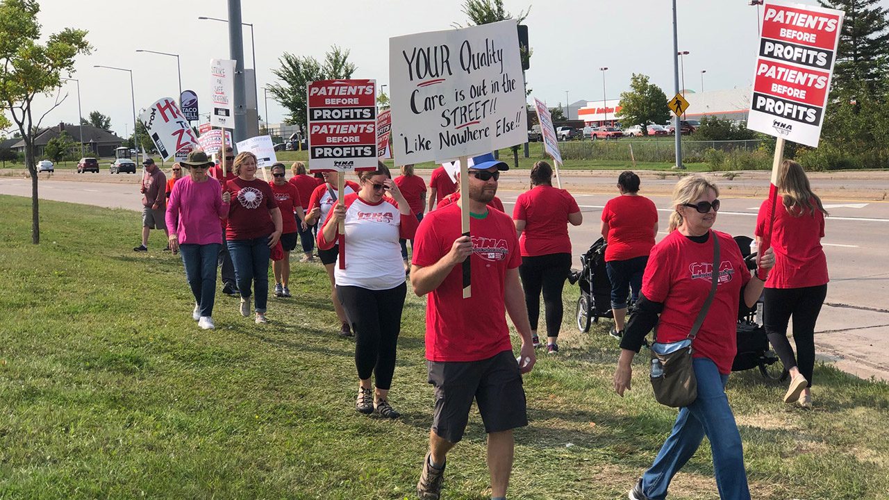 Nurses walk the picket lines in front of local hospitals