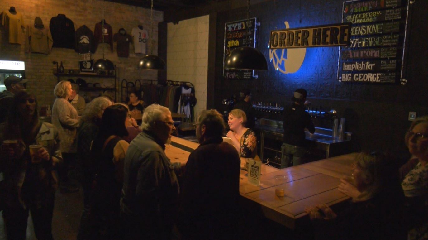 People order at the bar of Duluth Cider.