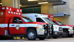 Three EMT rescue vehicles in garage
