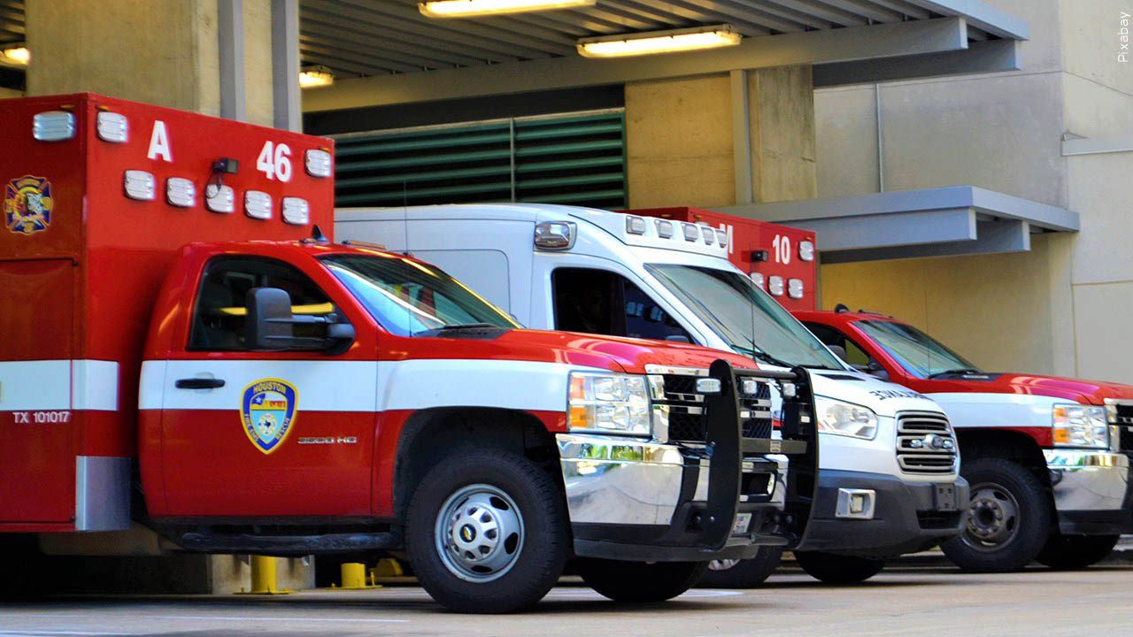 Three EMT rescue vehicles in garage