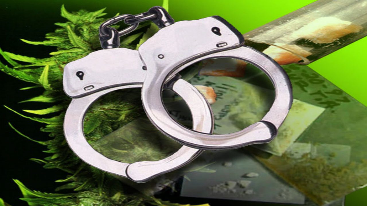Image of handcuffs with drug paraphernalia