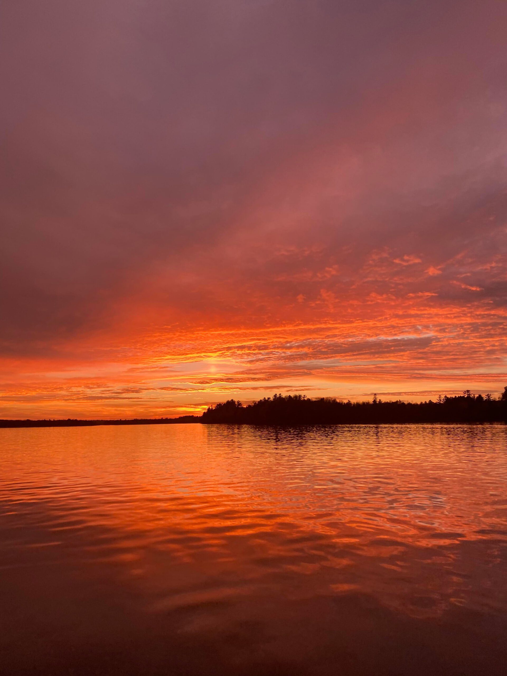 Bright orange and purple sunset over Pike Bay