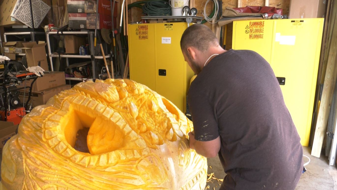 Mike Rudolph carves a more than 1,300-pound pumpkin