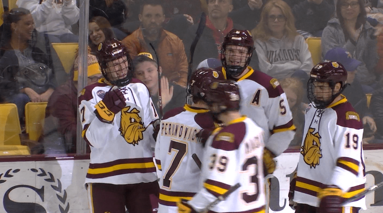 Former UMD forward Cole Koepke (L, #17).