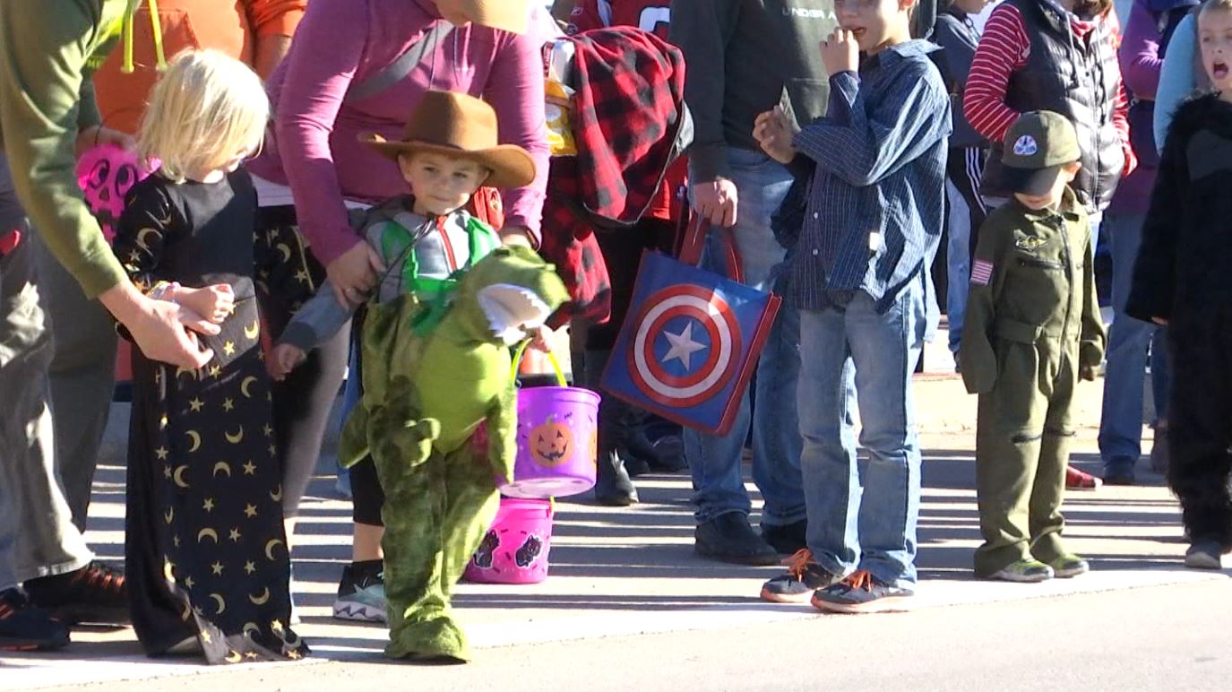 A child in a dinosaur costume