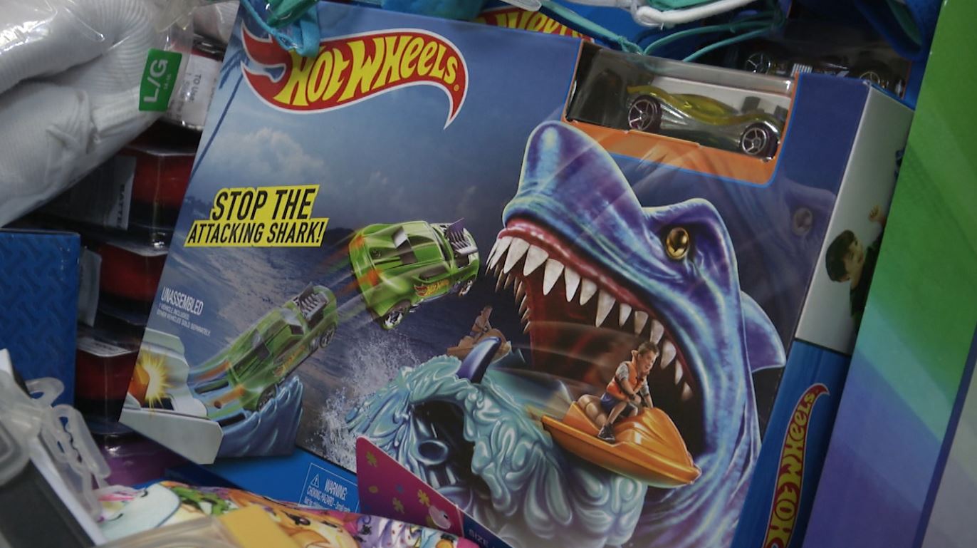 A Hot Wheels box in a stack of toys
