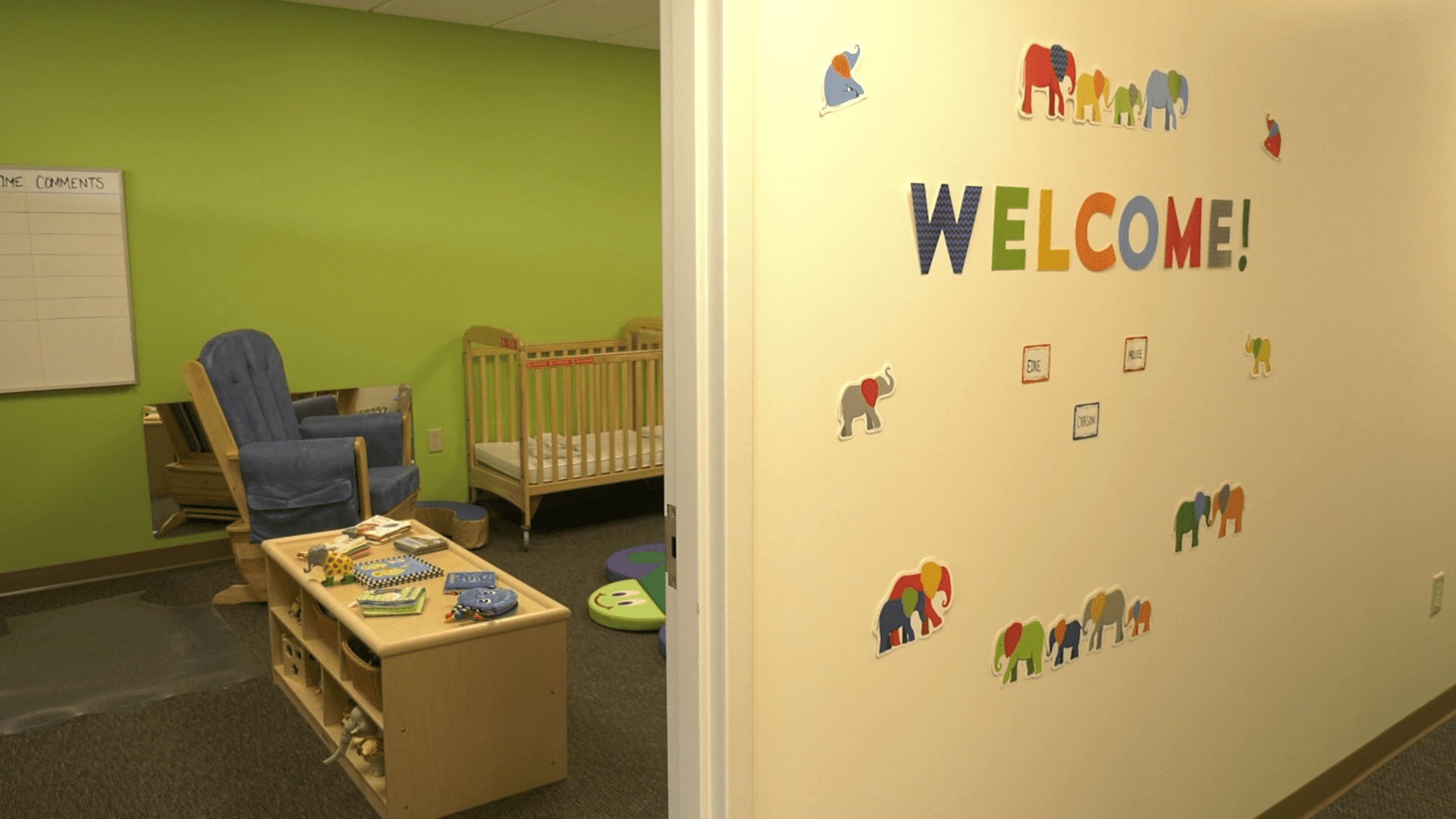 The word welcome on display on the wall inside a daycare