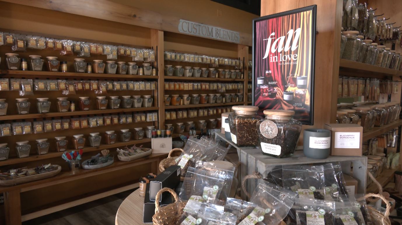 A table and shelves full of products at the Spice & Tea Exchange