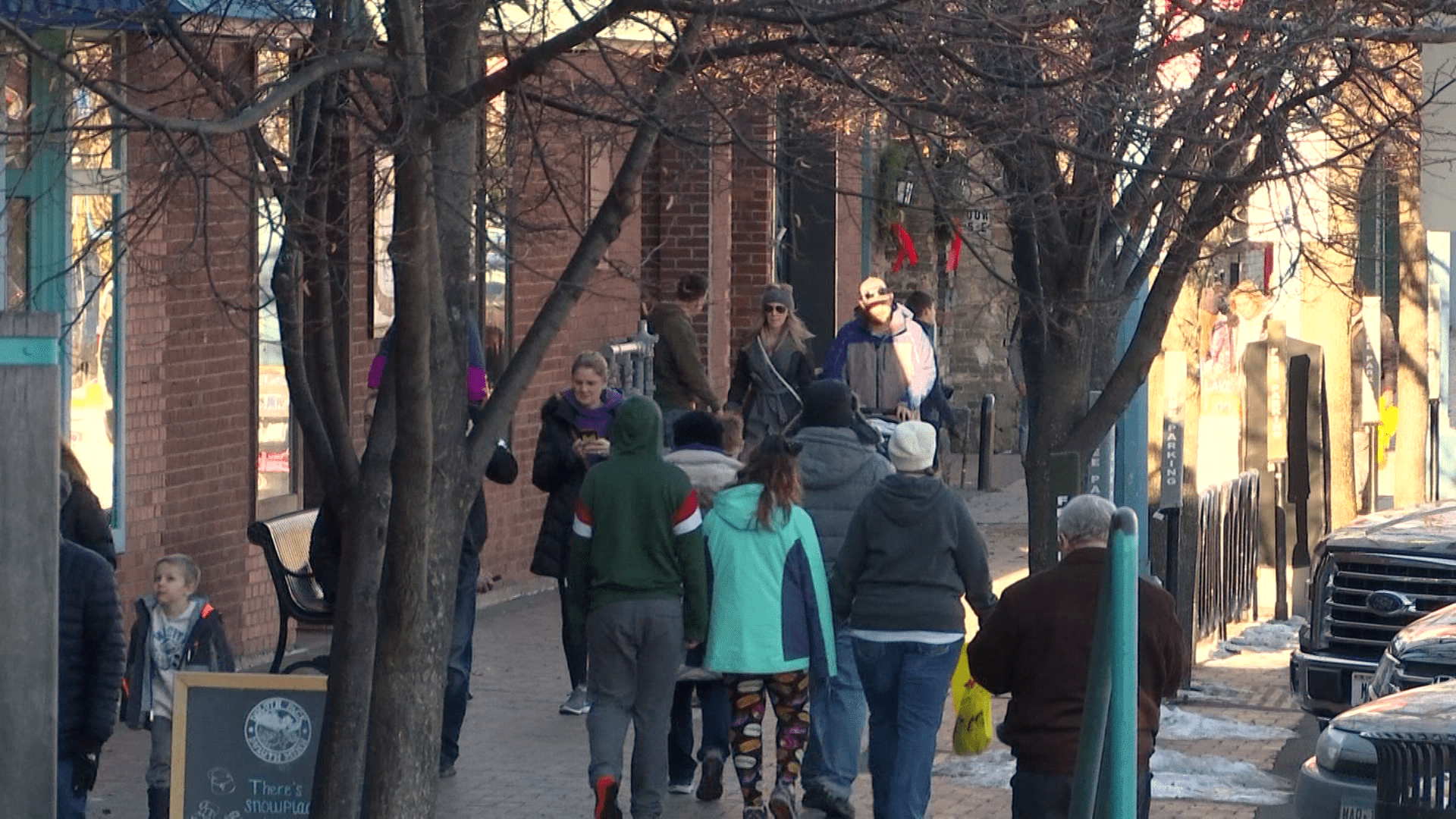 People walking on the sidewalk in Canal Park