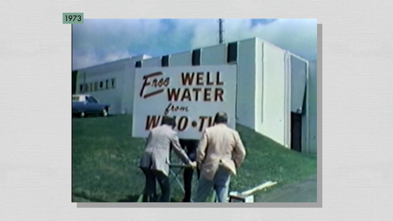 WDIO employees put up a "Well Water" sign outside the station in 1973