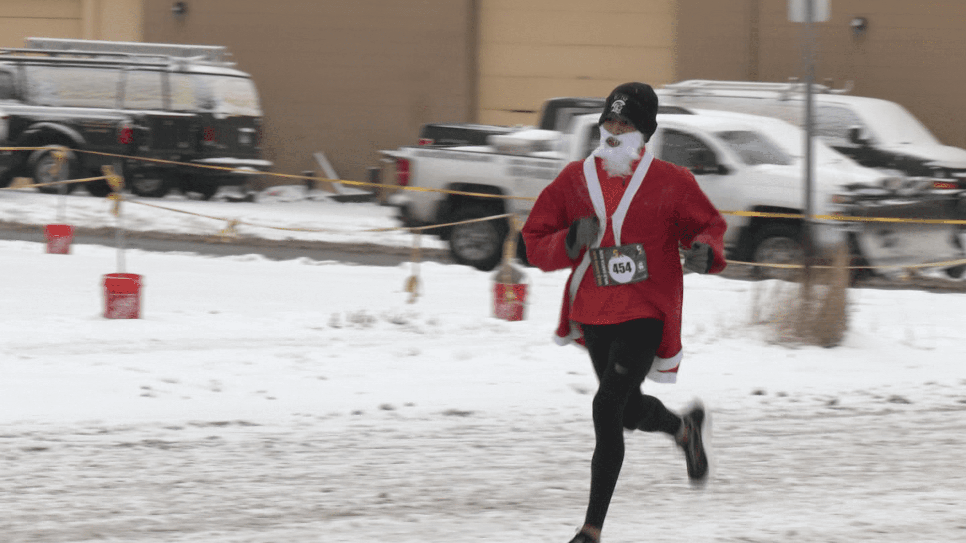 A man running in the Santa's 5K Race.