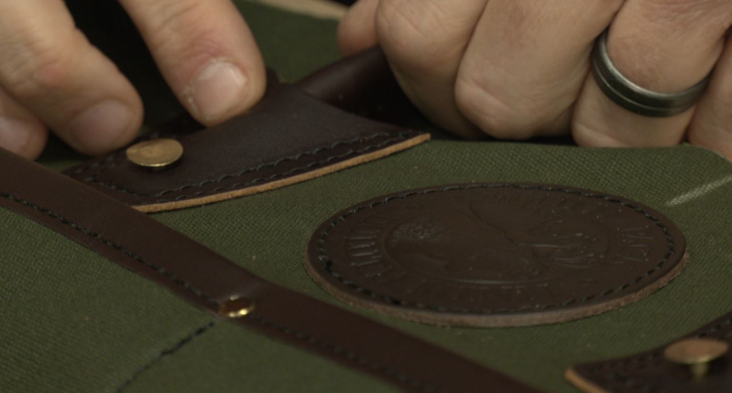 Rivets are hand-pounded into a Duluth Pack bag