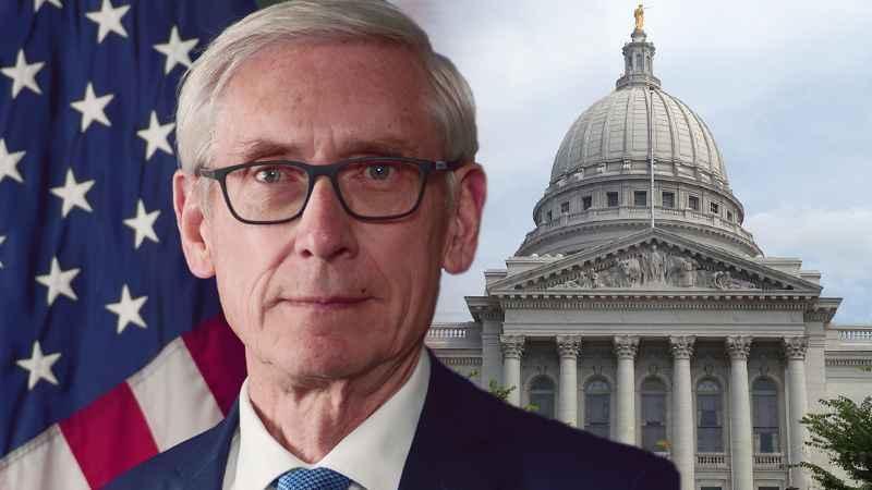 Altered image of Tony Evers over Wisconsin capitol building.