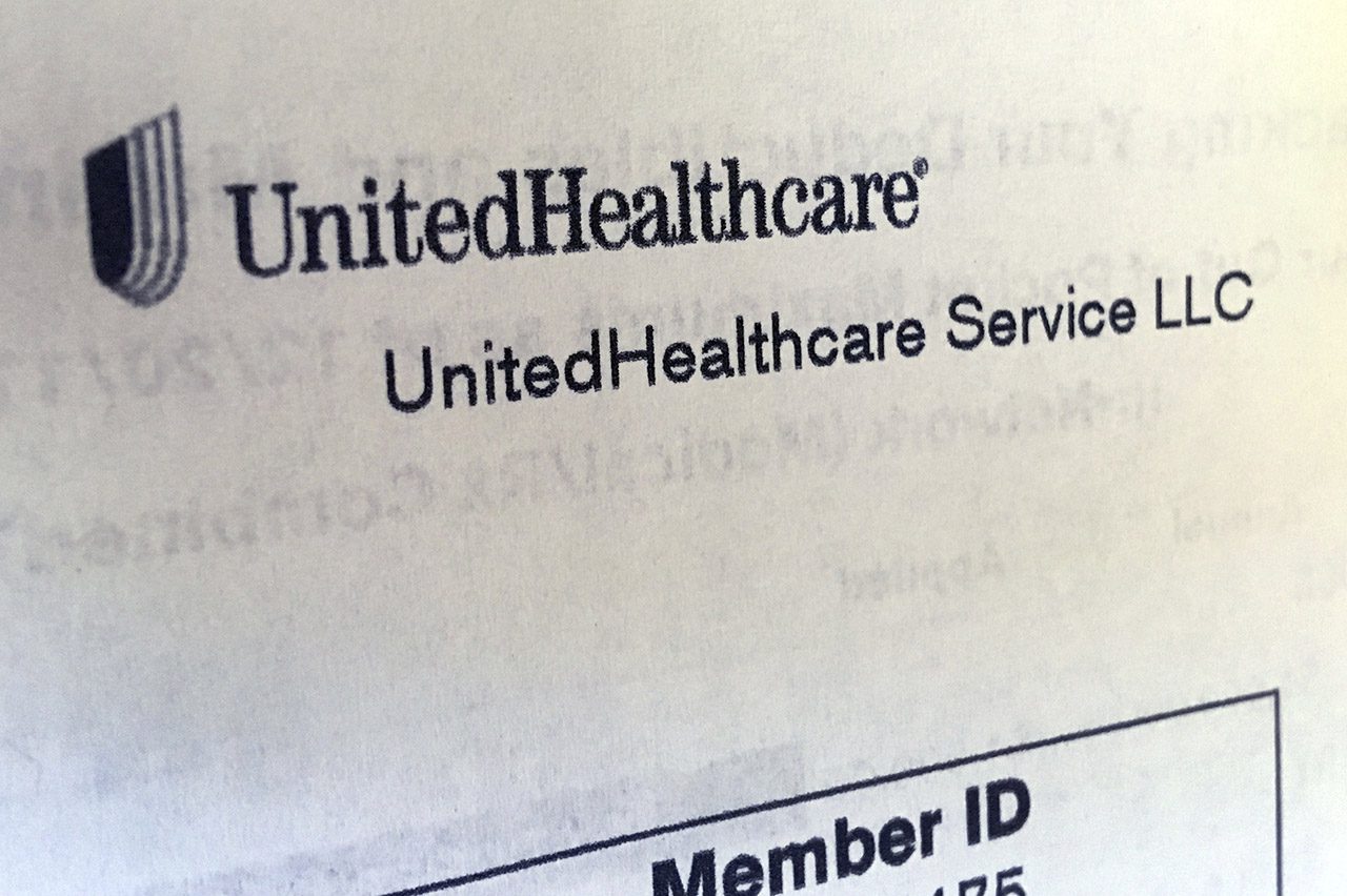 Angled paperwork showing UnitedHealthcare logo.