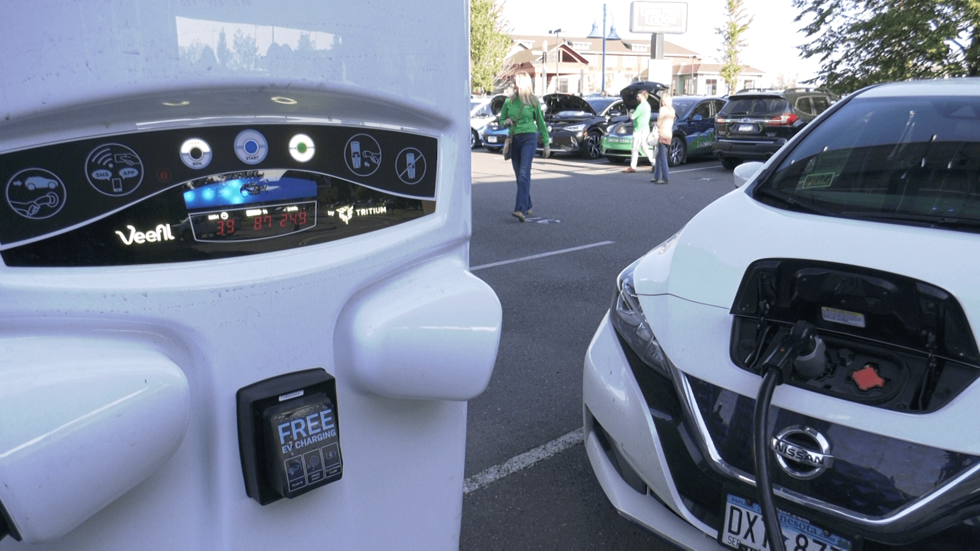 An electric vehicle at a charging station.