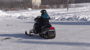 A rider on a snowmobile