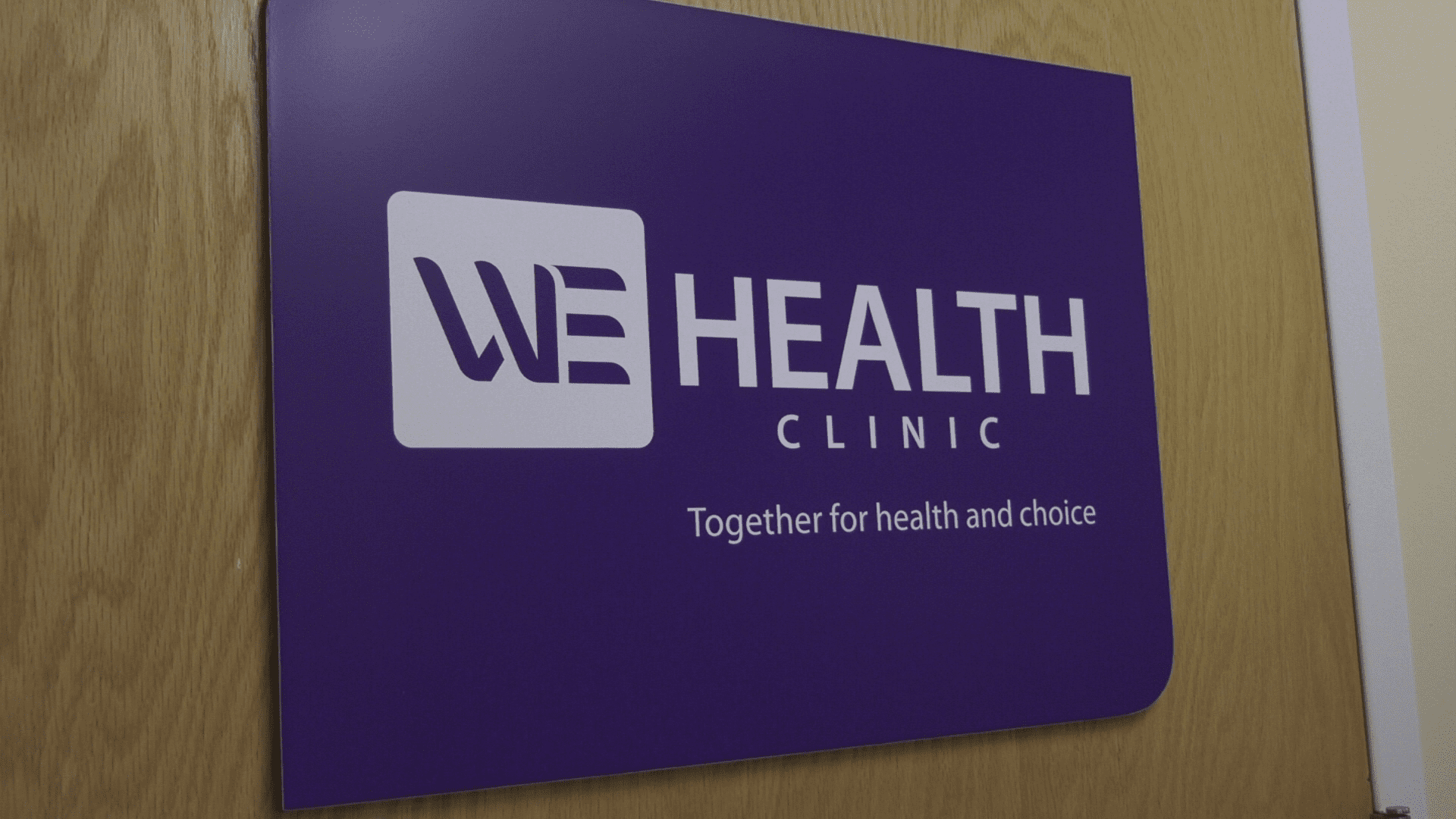 WE health care logo sign.