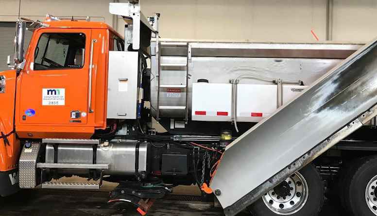 A orange snowplow with the Minnesota Department of Transportation