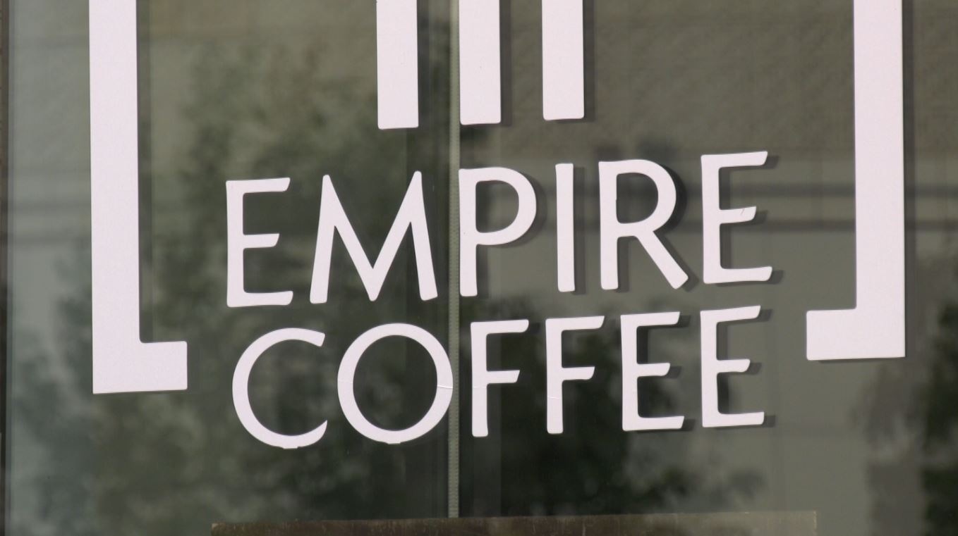 The logo on a window of Empire Coffee
