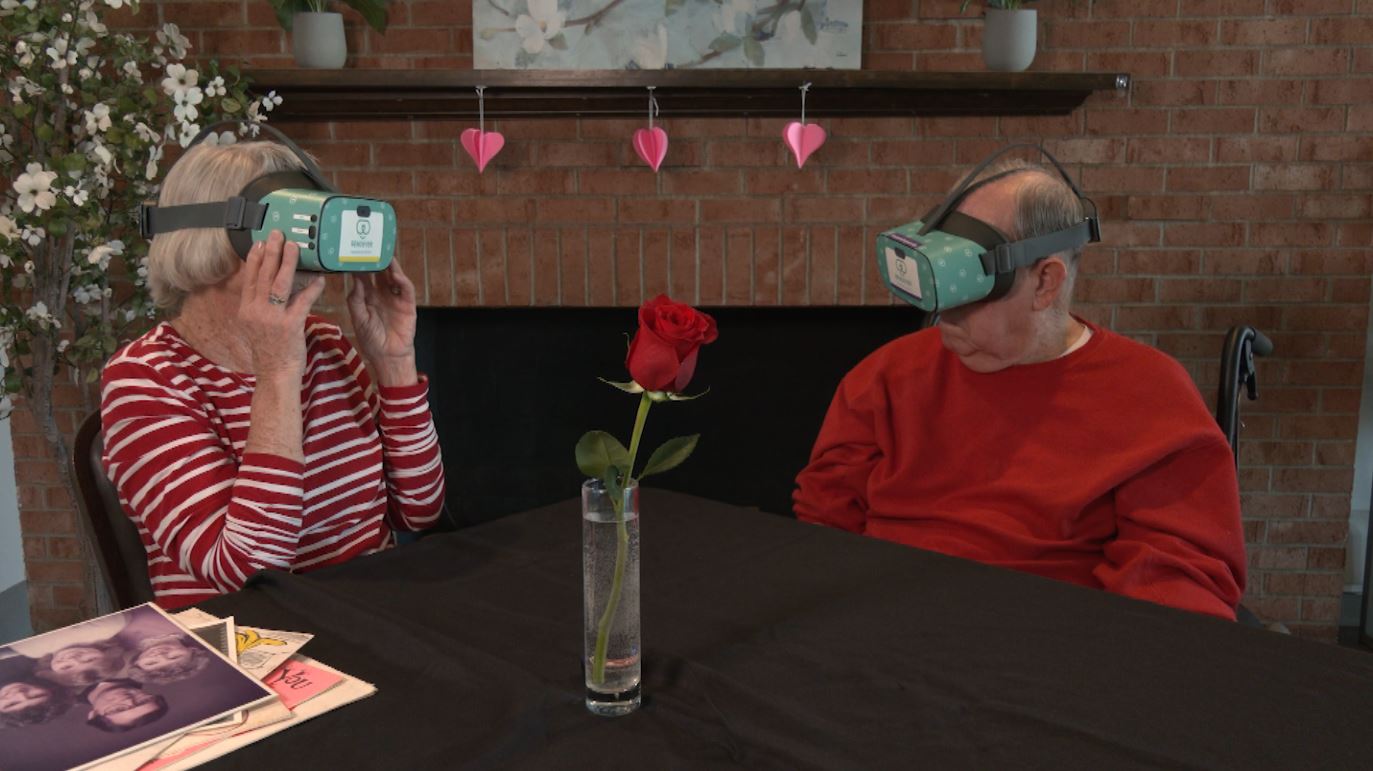 Gene and Melanie Gorham wear VR headsets.
