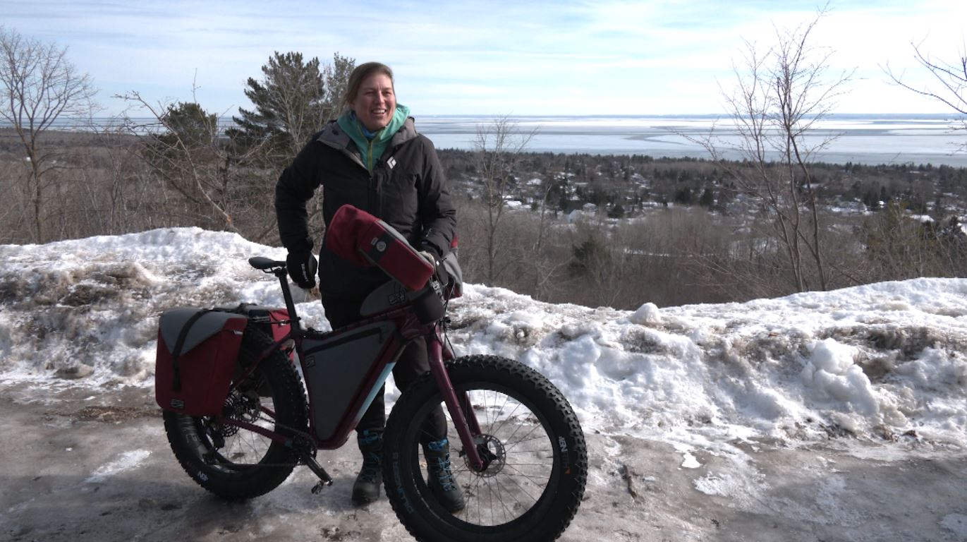 Leah Gruhn stands next to her fat tire bike