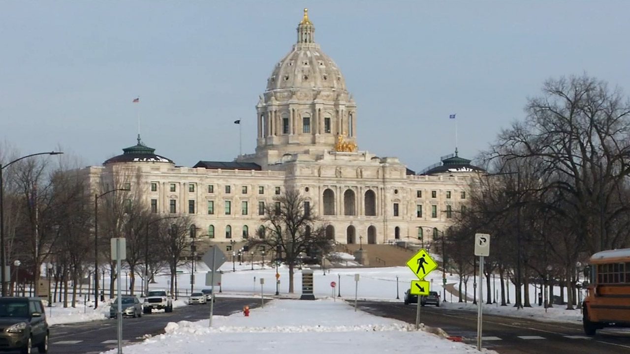 A winter shot of the Minnesota State Capitol straight on.
