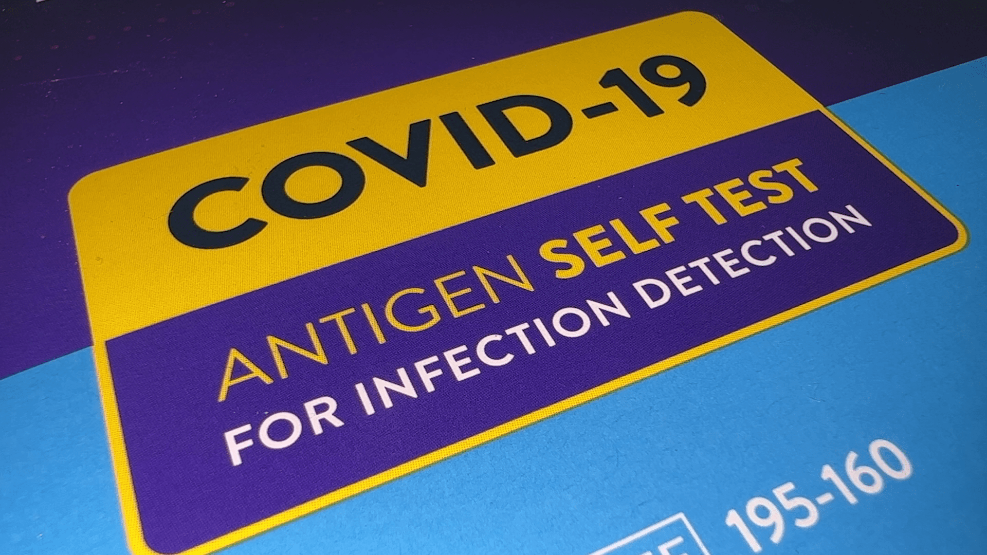 Full screen graphic sign stating COVID 19 antigen self test for infection detection.