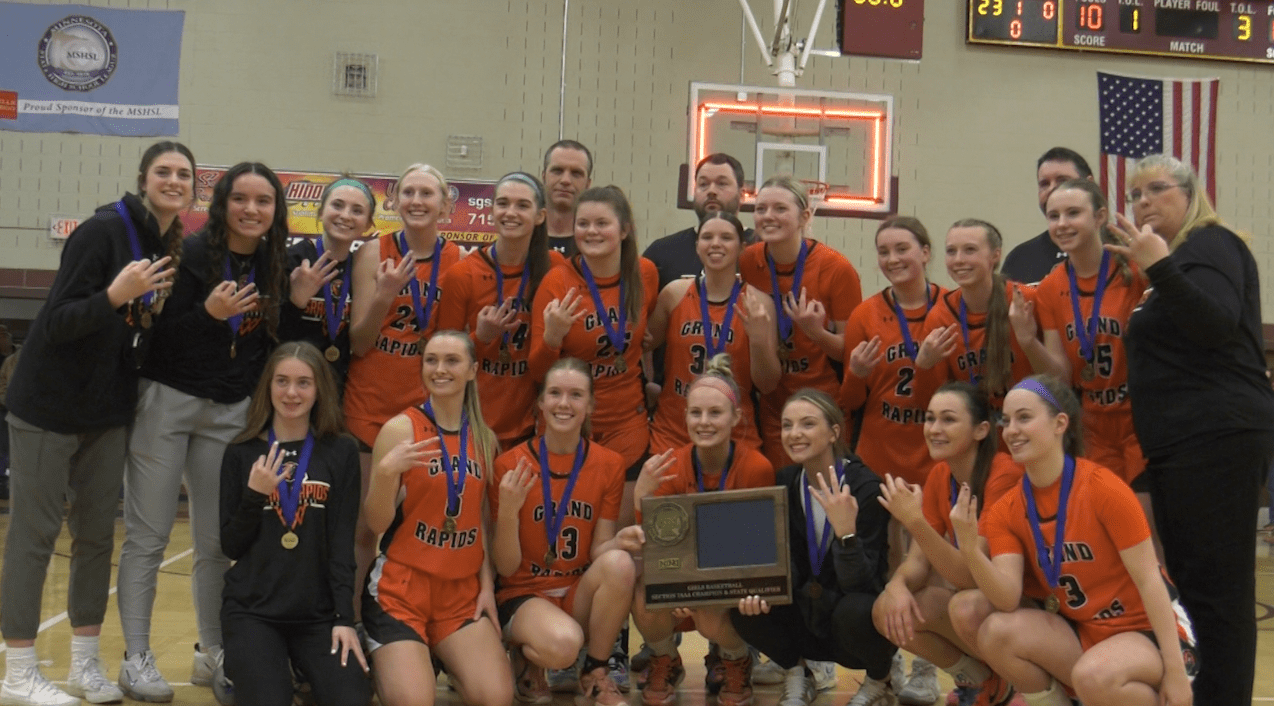 The Grand Rapids girls basketball team poses with their 2023 Section 7AAA trophy.