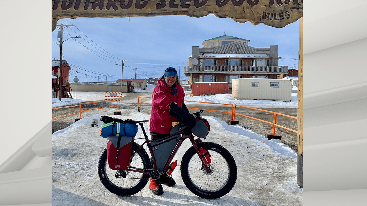 Leah Gruhn with her bike at the Iditarod finish line
