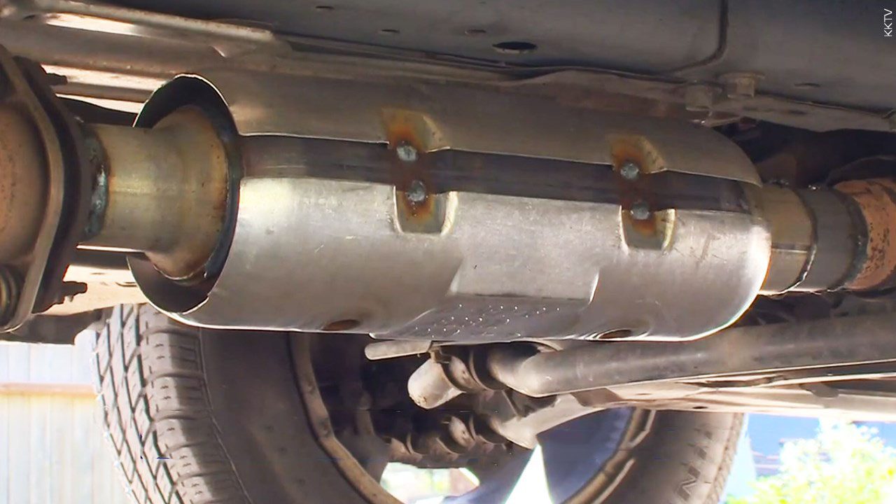 a view of a catalytic converter from underneath a vehicle.
