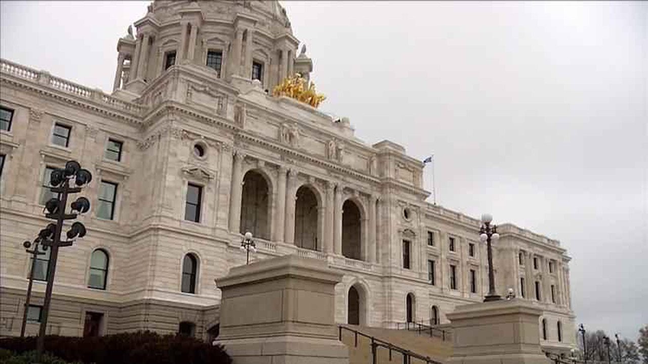 Looking up at the Minnesota State Capitol with the gold statues.