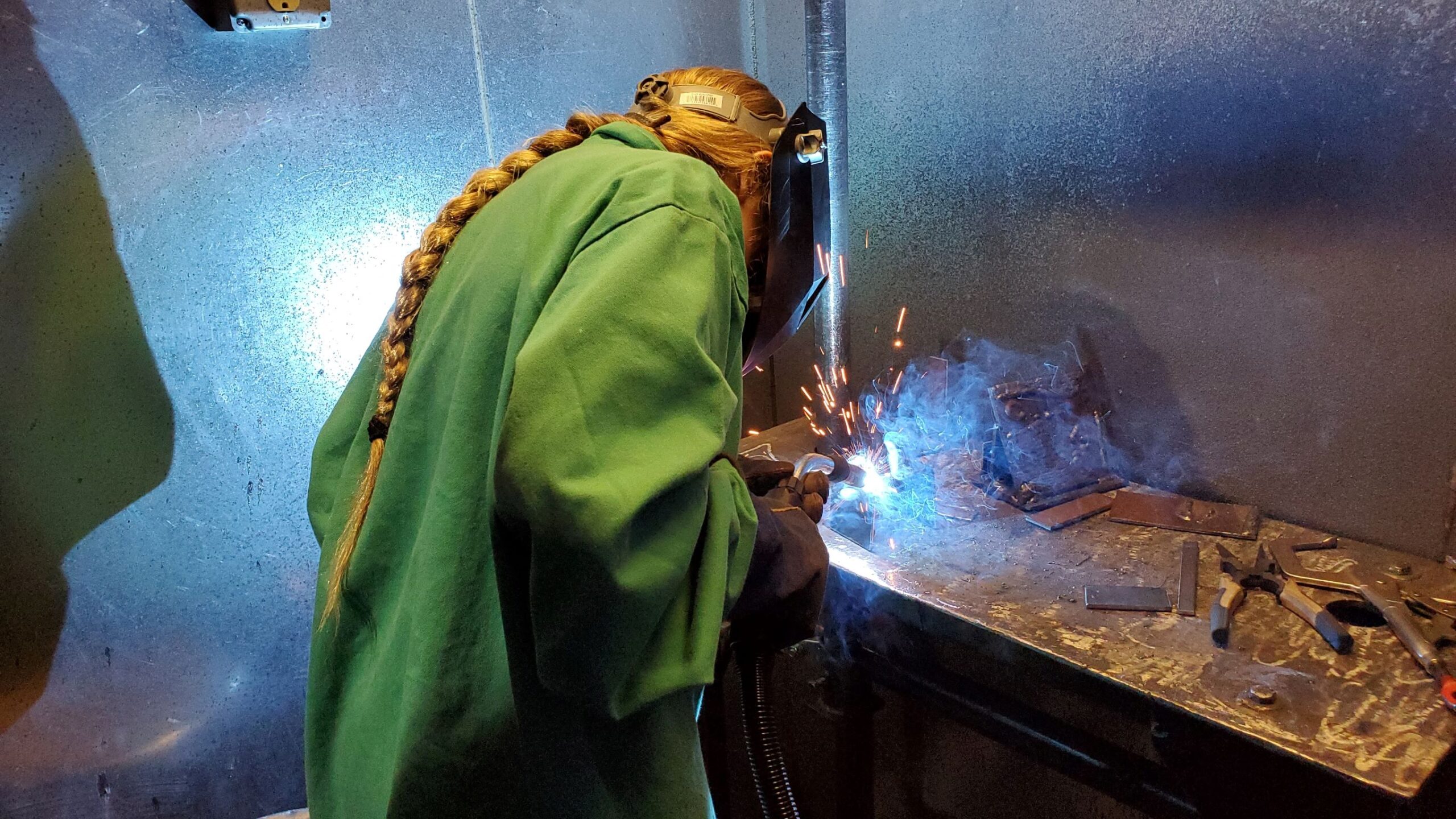 A student tries welding at a Lake Superior College summer camp