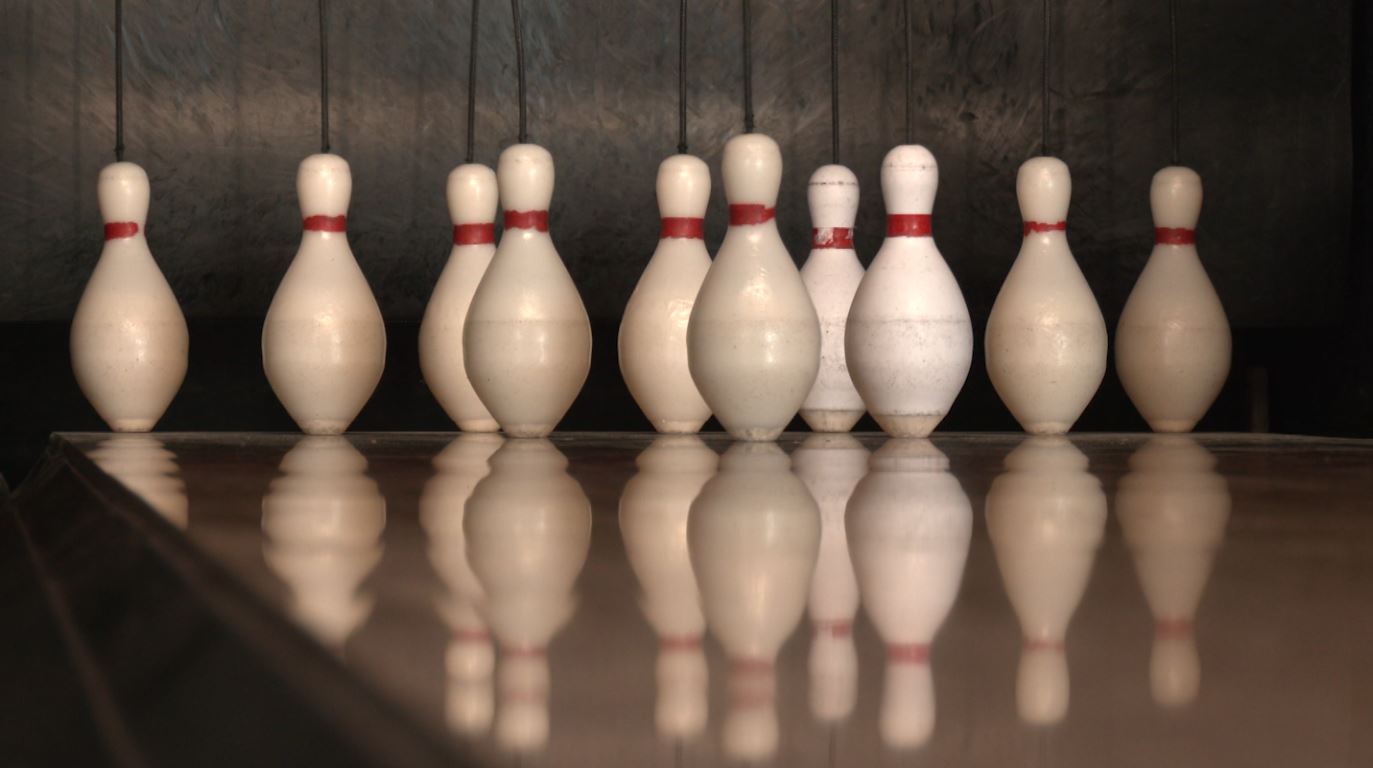 Duckpin bowling pins at the end of a lane