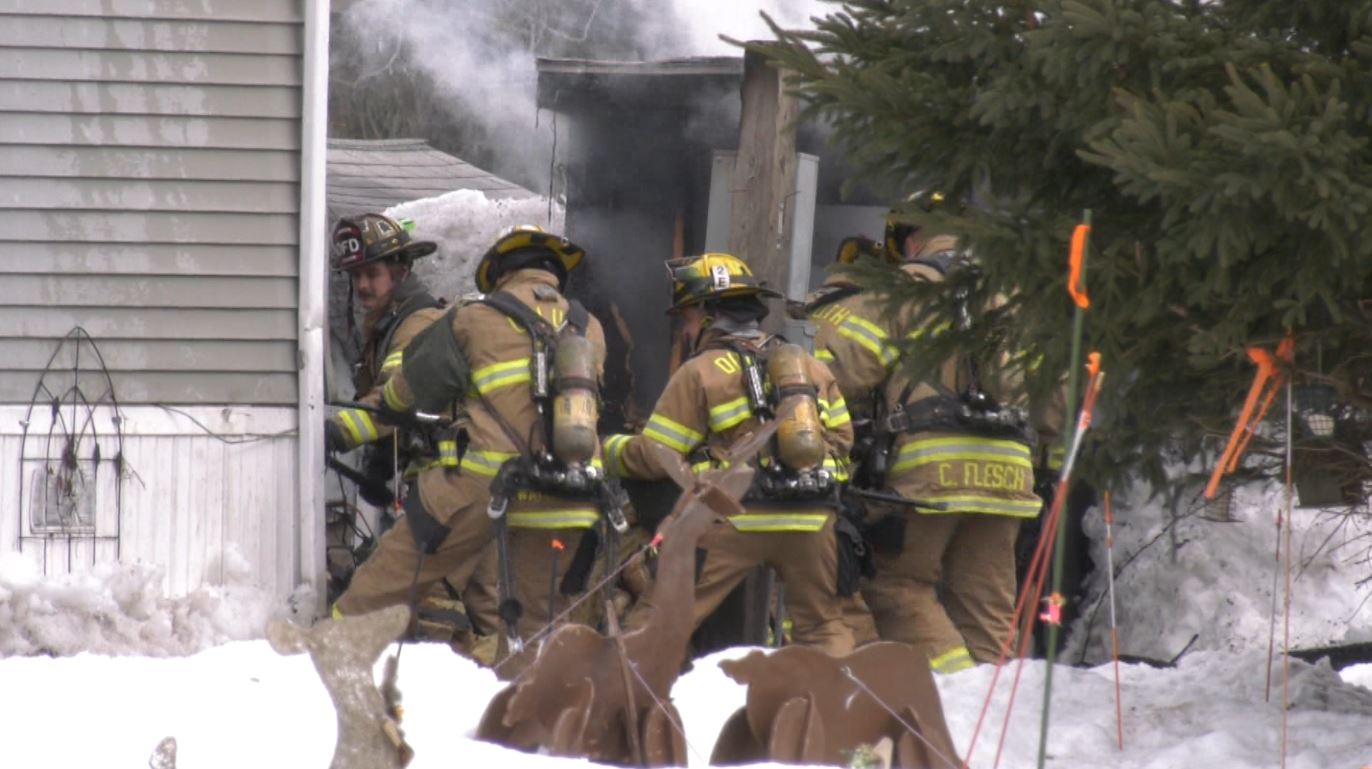 Firefighters put out a fire at a structure on Barker Drive in Duluth