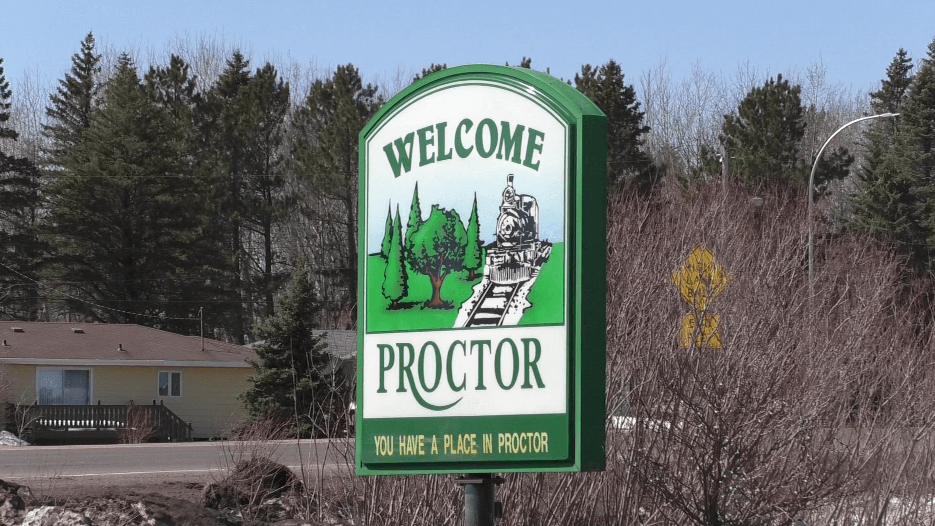 A Welcome to Proctor sign