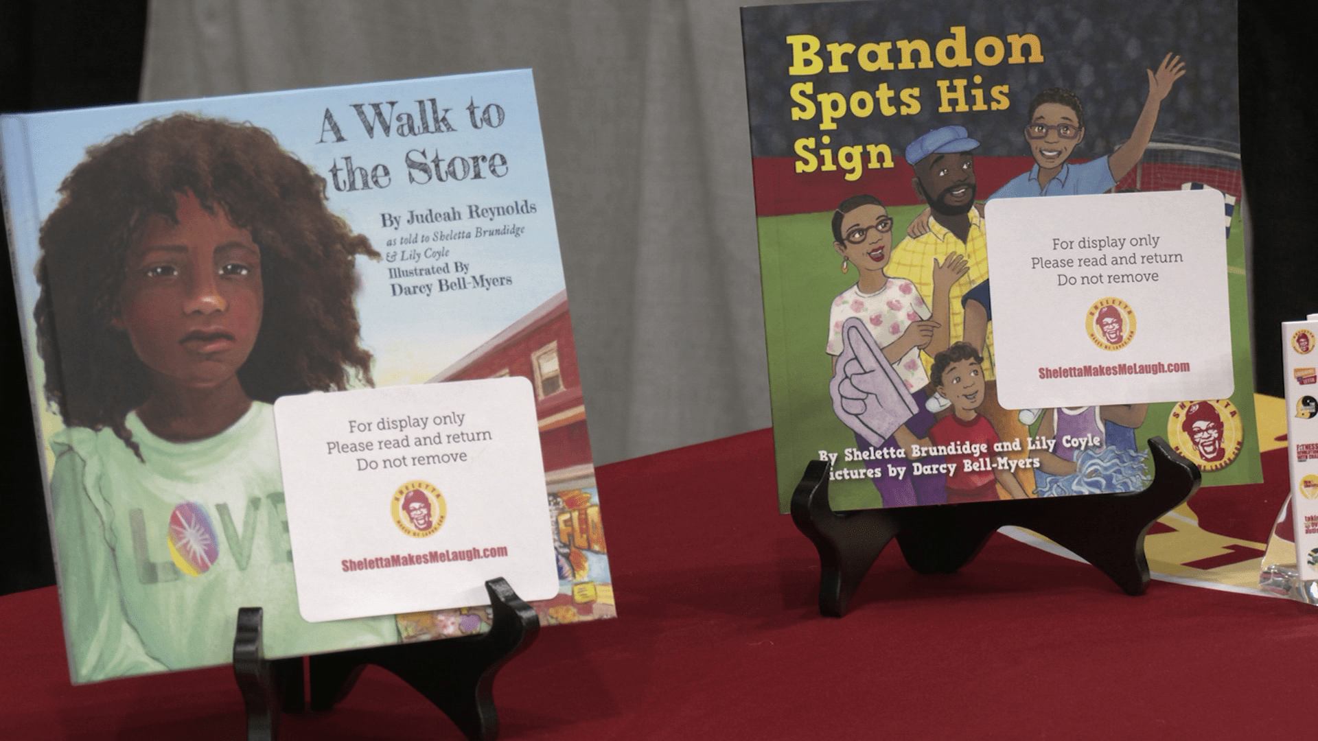 Photo of two books, A walk to the Store and Brandon Spots his Sign