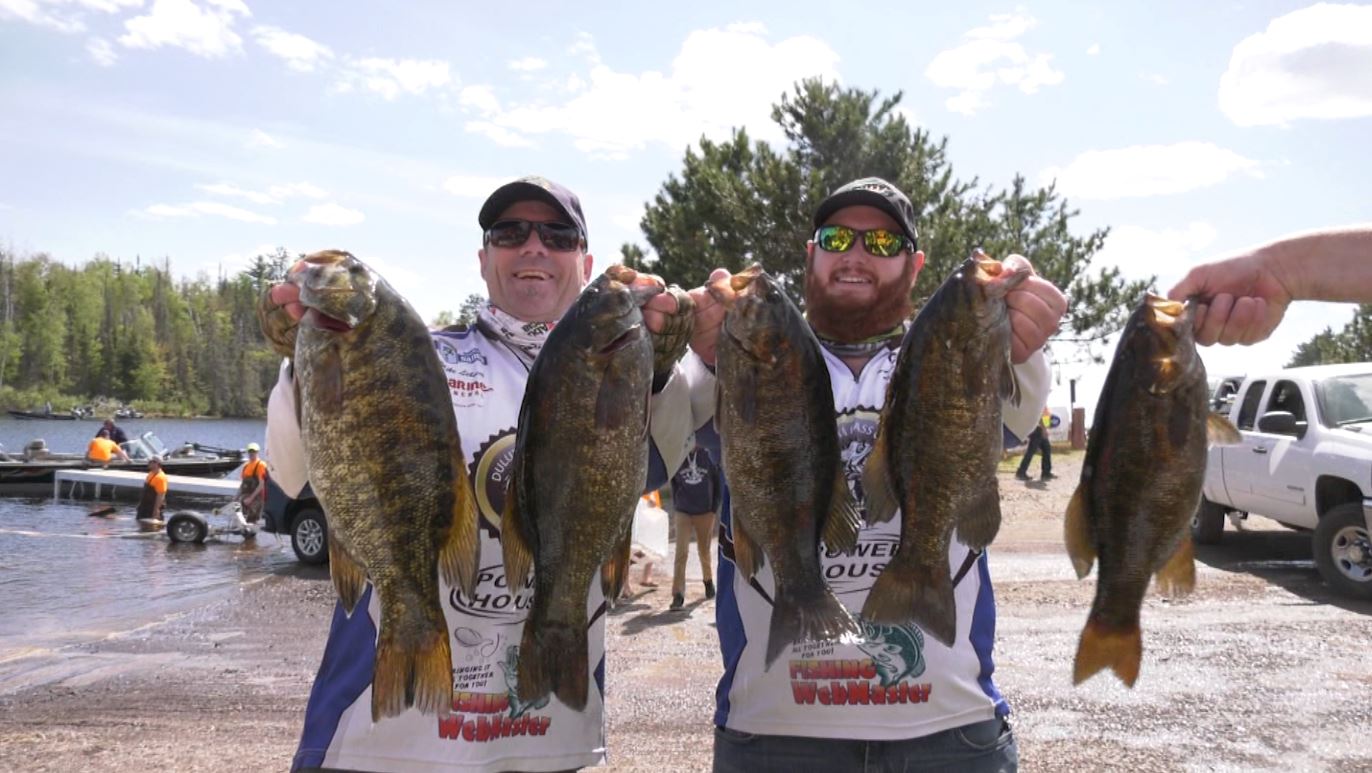 Anglers hold their catches at the 2019 ALS Fishing Tournament