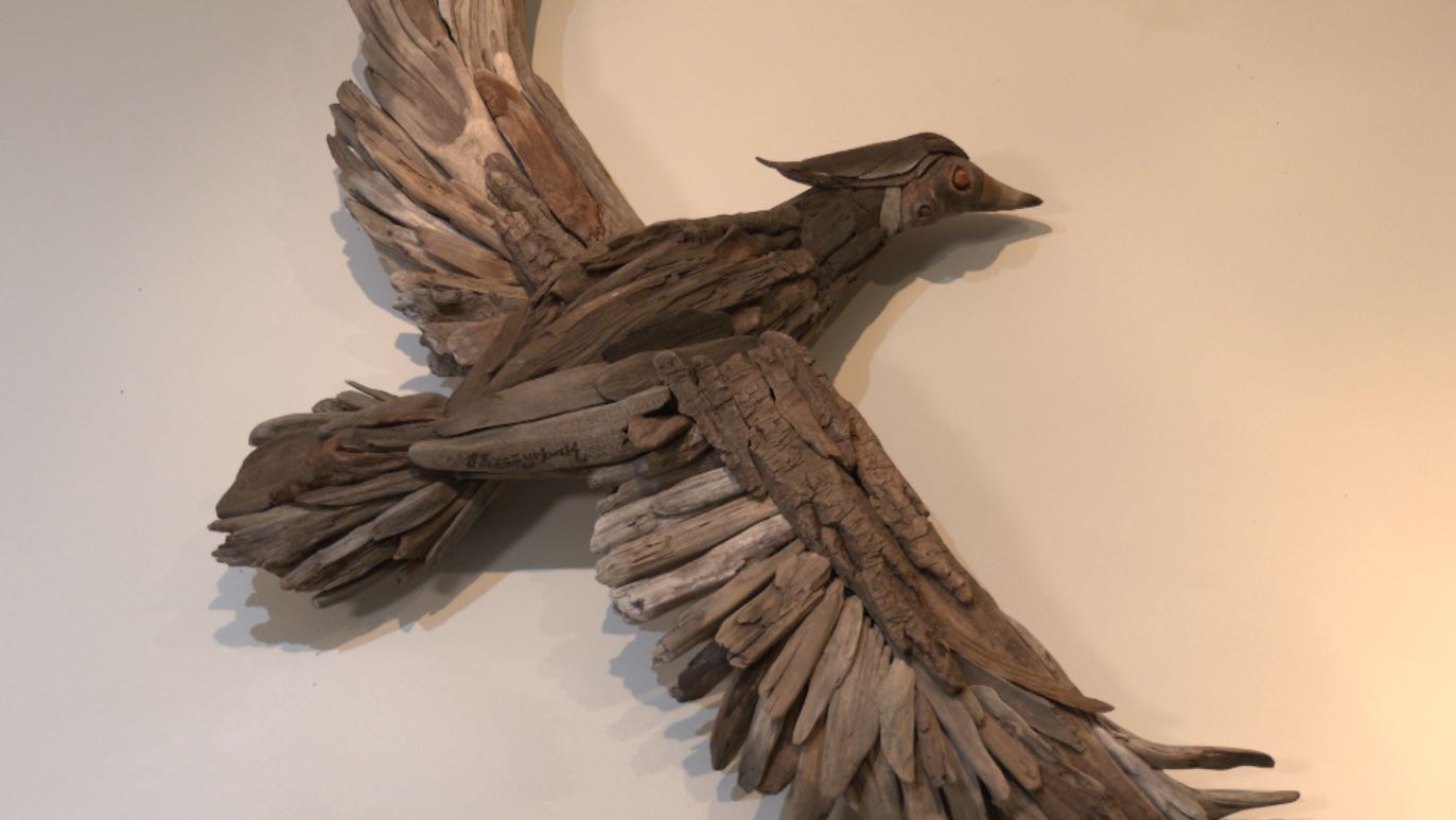 A Wood duck made of driftwood pieces
